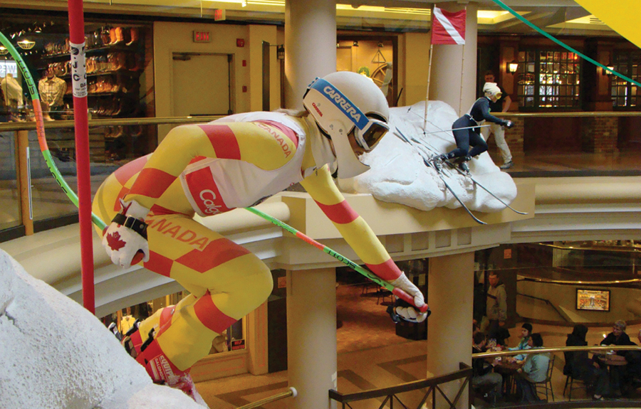 Sculpted displays of olympic downhill skiers in mall