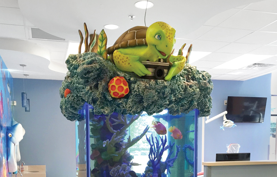 Custom aquarium decor of a cute turtle on top of 3d foam coral
