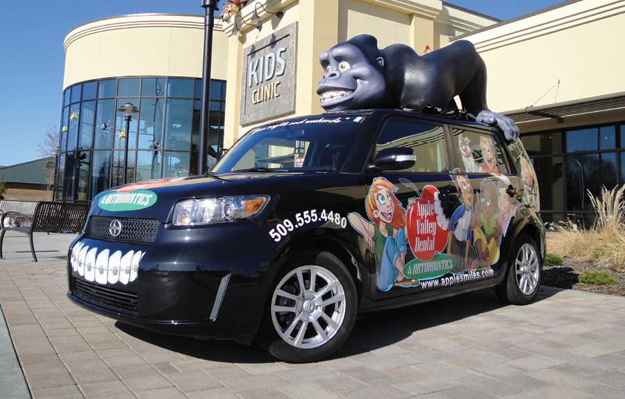 Promotional vehicle wrap with custom designed graphics and 3D foam mascot